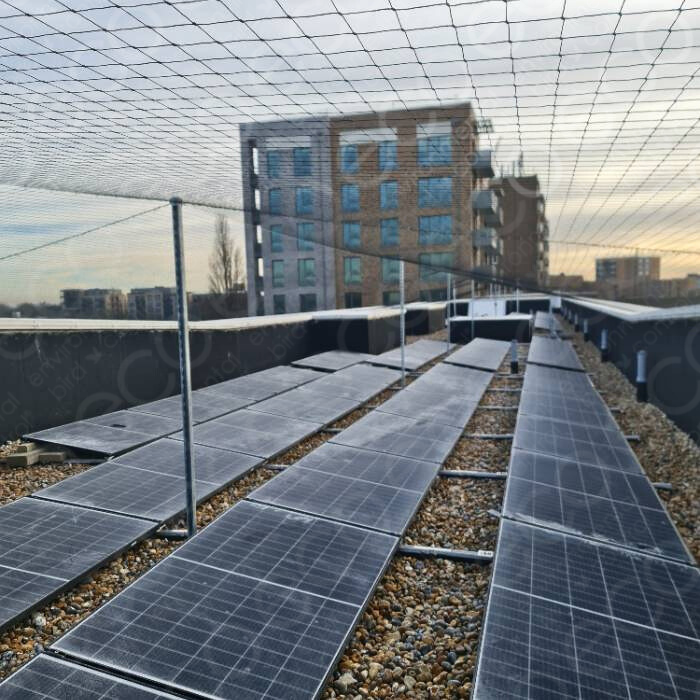 Netting System Installed to Ballast Roof with Solar panels